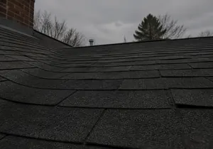 The same roof plane repaired with matching shingle